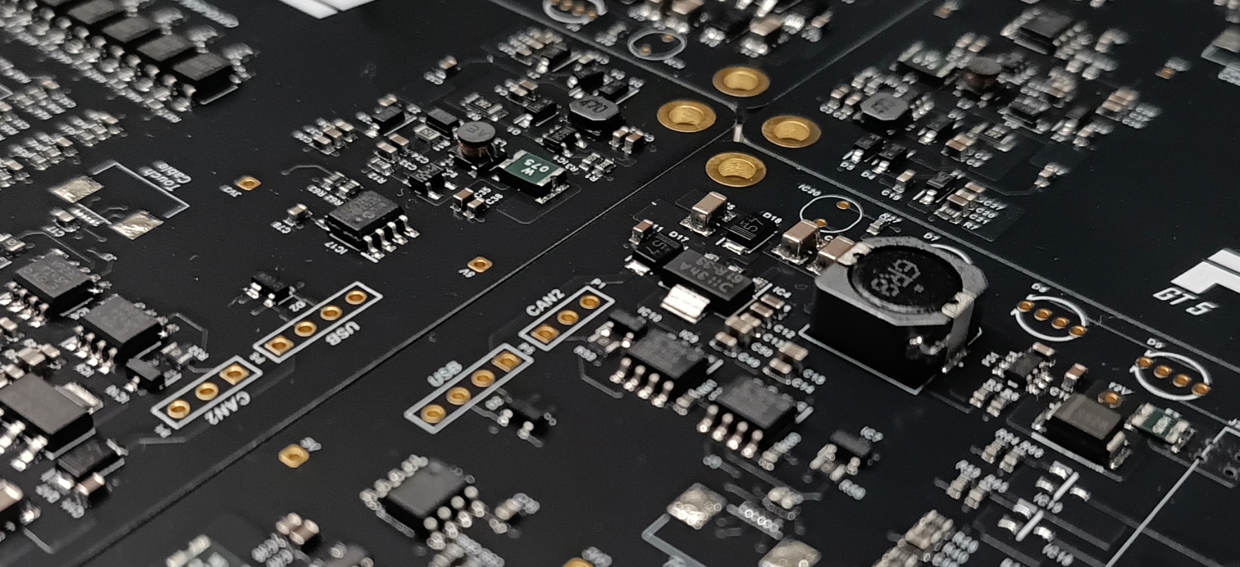 Macro view of a black PCB with fine-pitch SMD components