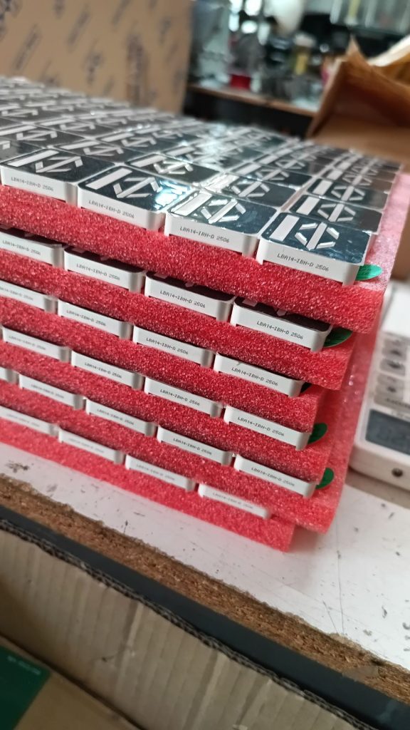 PCBs stacked in protective foam packaging