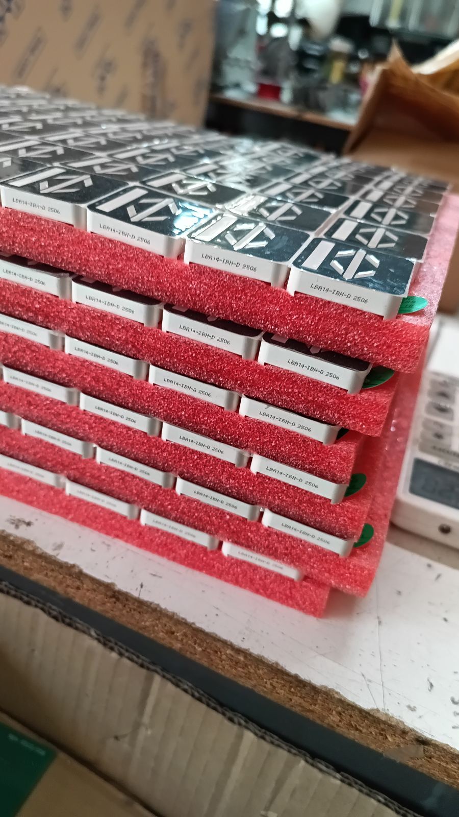 PCBs stacked in protective foam packaging