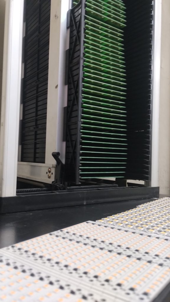 PCB magazine racks with panels in SMT production
