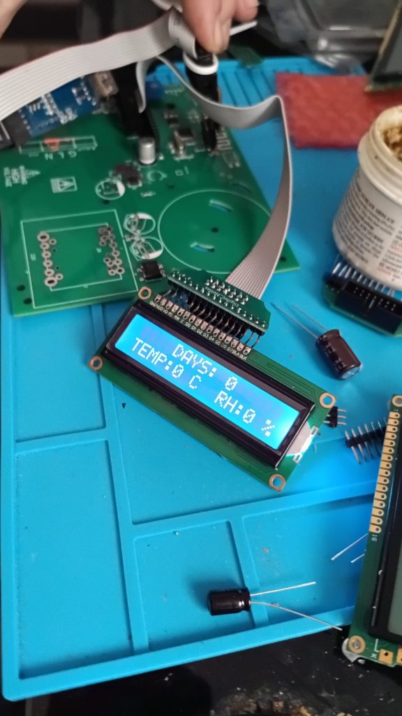 Electronics prototype with LCD module on a workbench