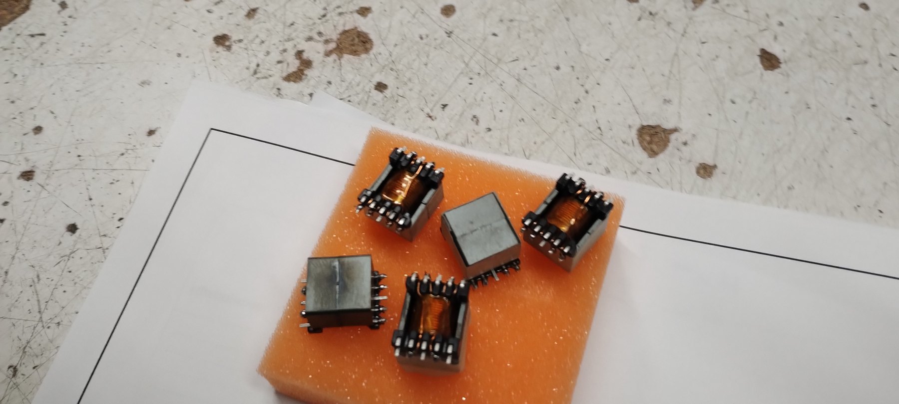 High-frequency SMD transformer samples wound and assembled by Digitec Hellas — custom magnetics